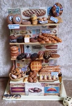 an assortment of pastries displayed on a shelf