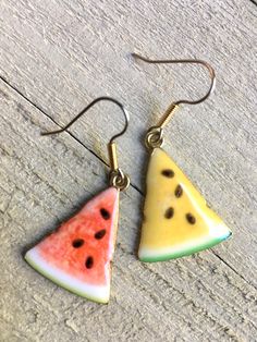 A Memorial Day cookout needs perfectly sliced red or yellow watermelon earrings. These take me back to my grandparent's home where I first tasted yellow watermelon. Charm is about 1 inch long and these come on two tone surgical steel ear wires. Lead Free and Nickel Free Alloy Metal charm Follow at instagram.com/ishasflowergarden! Join the fun www.facebook.com/ishasflowergarden. See all my jewelry: https://www.etsy.com/shop/IshasFlowerGarden?ref=hdr_shop_menu&section_id=10578500 All designs, Summer Multicolor Fruit Design Jewelry, Vintage Drop Earrings For Summer, Nickel Free Vintage Summer Jewelry, Nickel-free Vintage Summer Jewelry, Red Vintage Jewelry For Summer, Fun Yellow Round Jewelry, Handmade Watermelon Earrings For Summer, Handmade Watermelon Color Earrings For Summer, Watermelon Colored Summer Jewelry Gift