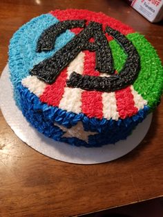 the cake is decorated with red, white and blue icing