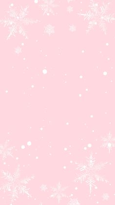 a pink background with white snowflakes on it