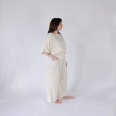 This is loungewear without limits. Comfortable and classy - this one-sized boat top is ideal for those looking to feel luxurious at home, on the town, with glam or on the go. Made with a luxe fabric composed of doubled Turkish muslin cotton. The crinkle muslin texture is incredibly soft on the skin, and feels lightweight, yet substantial when worn. Designed in an oversized style, the Crinkle Crop Top has half sleeves, with a cropped cut at the waist, and a boat neckline. Available in two color s Cream Linen Tops For Loungewear, Cream Linen Loungewear Tops, Spa Trip, Slouchy Pants, Pom Pom Pillows, Upcycled Bag, Animal Blanket, Kitchen Hand Towels, Sustainable Fashion Brands