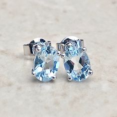 Beautiful 14 karat white gold studs earrings featuring two natural 7x5 mm oval aquamarines the birthstone for March! The gemstones weigh approximately 1.55 carat. Closure: Push Backs Weighs 0.86 gram. Birthstone: March. Condition: Brand New. - 14 day return policy, no questions asked. - Free insured shipping in the US. - International shipping available. Visit our website for more details about our company: www.weiljewelry.com Oval Birthstone Earrings In White Gold, Oval White Gold Earrings With Birthstone, Oval Gemstone Earrings For Anniversary, Gold Studs Earrings, Smoky Quartz Jewelry, Aquamarine Studs, White Gold Pendant Necklace, White Gold Earrings Studs, White Gold Studs