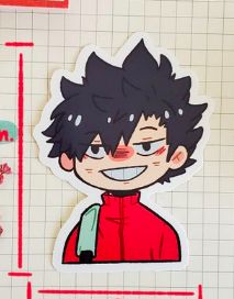 an image of a sticker of a boy with black hair and red shirt on