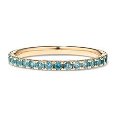 a yellow gold band with blue stones