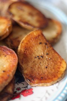 some fried potatoes are on a plate and ready to be eaten