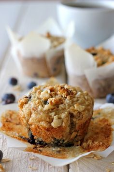 some blueberry muffins are sitting on a plate