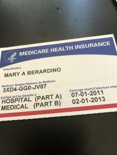 a medical health insurance card on a black table with the name mary a erardino