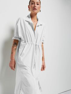 Because everyone needs an effortless shirt-dress, elevated with a shirred drawstring front and slits on the hem for a girly touch. Perfect for warm walks around the neighborhood and hiding from the heat at home after. (This one comes in Optic White.) | Irene Dress in Optic White | Ethical Essentials Spring Shirt Dress With Tie Waist And Relaxed Fit, Spring Relaxed Fit Shirt Dress With Tie Waist, Spring Dresses With Drawstring Tie For Daywear, Spring Collared Loungewear Dress, Relaxed Fit Shirt Dress With Tie Waist For Daywear, Relaxed Fit Dresses With Drawstring And Short Sleeves, Relaxed Fit Dress With Drawstring And Short Sleeves, Relaxed Fit Short Sleeve Dress With Drawstring, Casual Dresses With Relaxed Fit And Drawstring