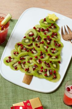 a christmas tree made out of kiwi slices on a plate