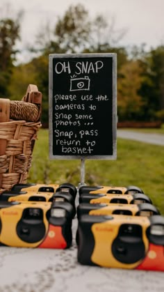 some yellow and black batteries are on a table with a sign that says oh snap