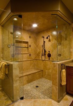 a bathroom with a walk in shower sitting next to a sink and a stand up shower