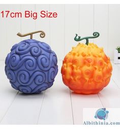 two colorful balls sitting next to each other on top of a white table with the words, 17cm big size