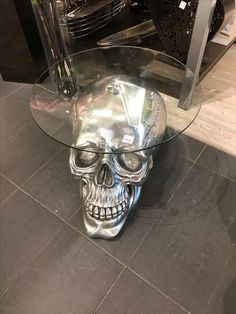 a glass table with a skull head on it