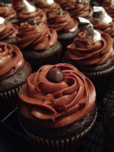 cupcakes with chocolate frosting on cooling racks