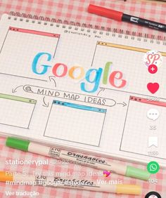 a notebook with the words google on it next to markers, pens and marker pads