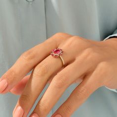 Celebrate your femininity with this gorgeous Ruby Floral Ring. This beautiful flower ring portrays elegance and charm. Crafted in the perfect sheen of 14k solid gold. - Made in 14k solid gold - Decorated with handset ruby coloured cubic zirconia stone on 14k solid gold - Band Width: 1.75 mm / 0.068 inches - Top Width: 13.45x11.40 mm / 0.529x0.448 inches - Thickness: 1.00 mm / 0.039 inches -This product comes with iconic Norm Jewels gift box Rings For Women Unique, 40th Anniversary Gifts, Flower Rings, Solid Gold Band, Floral Ring, Red Gemstones, Rose Gold Band, Gold Decor, Ruby Ring