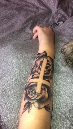 #follow #tattooideas #tattoos #blogging #blog #blogger Crosses With Roses Tattoo, Tattoo Ideas Top Of Arm, Arm Tattoos For Women Outer Forearm, Cross Rose Tattoo For Women, Arm Tattoos For Women Roses, Rose Tattoo On Forearm For Women, Cross Arm Tattoo Women, Cross And Rose Tattoo For Women