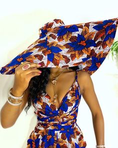 "Keep it cute and chic in our \" Massive Oversized Floppy Kente Print Sun Hat\" this season. This is a one size fits all, lightweight, durable and uniquely sewn hat made from high quality African Ankara print. This hat may help keep your face shaded from the sun as you embark on a full day outdoors and it is sure to turn heads wherever you choose to wear it to. The possibilities are endless with this beautiful well constructed hat! It's the perfect look for your summer vacation, baecation, weeke Chitenge Outfits, Modern African Clothing, Printed Bridesmaid Dresses, African Print Jumpsuit, Kente Print, Best African Dresses, African Inspired Clothing, African Wedding Dress, Romper Shorts