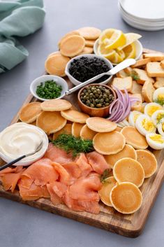 a wooden board topped with different types of food