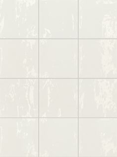 a white tile wall that is very clean