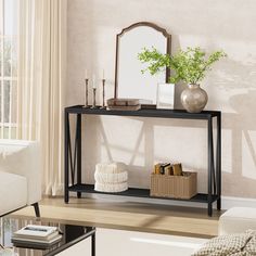 a living room with a couch, table and mirror on it's sideboard