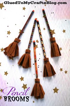 four brown tassels on top of a white background with gold stars and the words pencil brooms