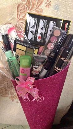 a pink bucket filled with cosmetics and makeup products