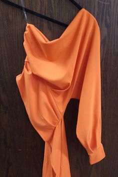 This orange one shoulder drape top is a statement piece. -One Shoulder Top -Stretch 97% POLYESTER, 3% SPANDEX Drape Top, Draped Top, One Shoulder Tops, Statement Pieces, Shoulder Top, One Shoulder, Spandex, Orange