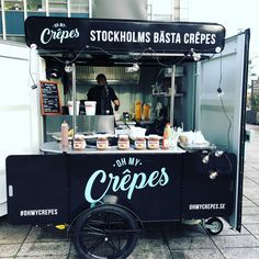 a food cart that is sitting on the ground