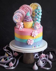 a multi - colored cake decorated with candy and candies