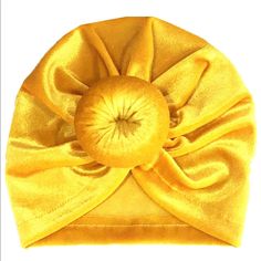 a yellow hat with a big bow on it