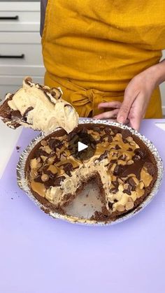 a person cutting into a pie with a knife