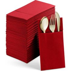 a stack of red napkins with silverware in it