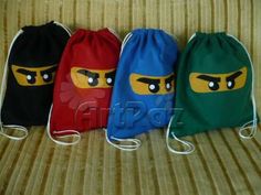 three drawstring bags with lego characters on them