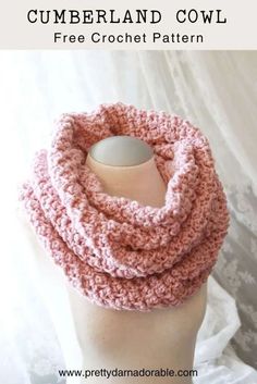 a pink crochet cowl on top of a mannequin