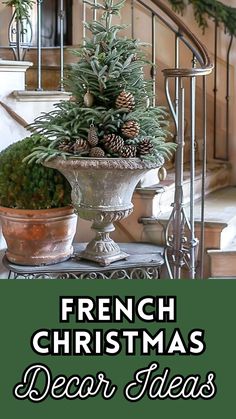 a christmas tree sitting on top of a potted plant in front of a stair case