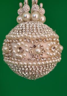 an ornament with pearls and diamonds on it