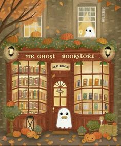 a book store with pumpkins and ghost decorations