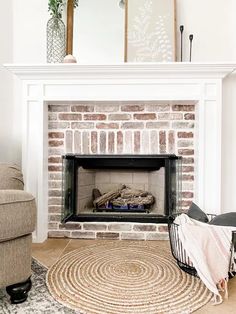 a living room with a fire place and rug