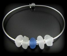 "THE SEA GLASS:  For the bride or for the beach lover, the romantic sea glass pieces in this handsome, nautical bracelet were each beachcombed by me from a shore along the majestic Pacific Ocean. I walk and hunt for sea glass in what is often named the Pacific Ocean Graveyard; a stretch of beaches known for their long ago shipwrecks and maritime history.  The rarer soft blue likely originates from vintage, medicine bottle glass, the frosty whites are also likely to be antique bottle glass.  Each Adjustable Ocean-inspired Sea Glass Jewelry, Clear Glass Jewelry For Beach, Adjustable Blue Jewelry Made Of Recycled Glass, Adjustable Blue Jewelry With Recycled Glass, Adjustable Blue Recycled Glass Jewelry, Beach Glass Bracelet Jewelry, White Recycled Glass Jewelry For The Beach, Seaglass Beach, Coastal Jewelry