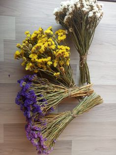 dried flowers laid out on a wooden surface