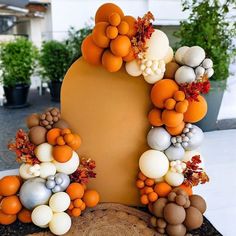 an orange and white decoration on top of a tree stump