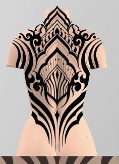 the back of a woman's body with black and white designs on her chest