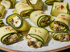 zucchini rolls with cheese and herbs on a plate