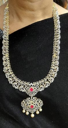 18 Karat Gold 'Detachable - 4 In 1' Diamond Long Necklace With Color Stones & South Sea Pearls
    It can be used as a Short Necklace
  This Product has a Detachable Pendant which can be used as a separate Pendant with most Chains.
  This product has Inter Changeable Stones in the Necklace and Pendant.
   Length of the Short Necklace without Pendant & Back chain : 7.00 inches 
  Length of the Pendant : 2.80 inches
  Width of the Pendant : 2.05 inches  

Introducing our exquisite 18 Kar Temple Jewelry Diamond Necklace With Single Cut Diamonds, Temple Jewelry Necklace With Single Cut Diamonds, Temple Style Diamond Necklace For Reception, Festive Yellow Gold Diamond Bridal Necklace, Festive Temple Jewelry Style Diamond Necklace, Diamond Long Necklace, Detachable Pendant, Back Chain, Color Stones