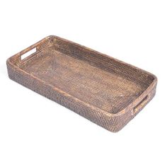 a brown wicker tray on a white background