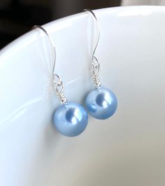 Something Blue, Light Blue Swarovski Pearl Earrings, Blue Swarovski Jewelry, Womens Earrings, Gift for Her, Bridal Pearl Earrings, UK Stunning light blue Swarovski pearl earrings. These are are extremely beautiful. Perfect as a gift to someone special or a little treat for you. Fabulous too as wedding earrings for the bride, bridesmaids or mother of the bride or groom. This beauty is super light and comfortable to wear.  Completed with 10 mm Swarovski pearls in a light blue shade and mini silver Nickel-free Blue Pearl Earrings Gift, Blue Sterling Silver Pearl Earrings As Gift, Handmade Blue Pearl Earrings In Sterling Silver, Handmade Blue Sterling Silver Pearl Earrings, Blue Teardrop Sterling Silver Pearl Earrings, Blue Teardrop Pearl Earrings For Pierced Ears, Bridal Pearl Earrings, Womens Earrings, Bridal Earrings Pearl