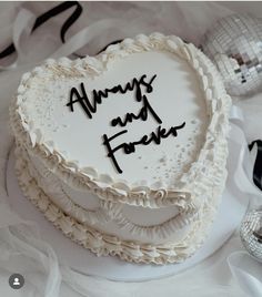 a white cake with black writing on it