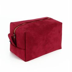 Womens travel toiletry bag We designed this chic toiletry bag bag thinking about stylish and classy women, who appreciate classy elegance and good design.  As the outer fabric we have used finest vegan suede, which feels like velvet, in deep crimson red. We have lined it inside with an impregnated polyamid fabric, that is waterproof and also very easy to clean. There are three pockets on the sides, that will help to organize all the little accessories. This unique cosmetic bag opens and closes with a brass zipper of a golden shade. Its size is 19x11x11cm. - it will fit all the essential cosmetics necessary for a weekend travel or longer journeys. However it is still so compact that it won't take too much space in your suitcase, weekender bag or a backpack. Outer fabric has a special formul Cheap Red Cosmetic Bag With Zipper, Red Makeup Bag, Designer Makeup Bag, Designer Makeup, Leather Toiletry Bag, Travel Toiletry Bag, Makeup Holder, Vegan Cosmetics, Red Makeup