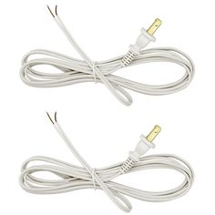 two white corded wires with gold connectors are shown in front of a white background